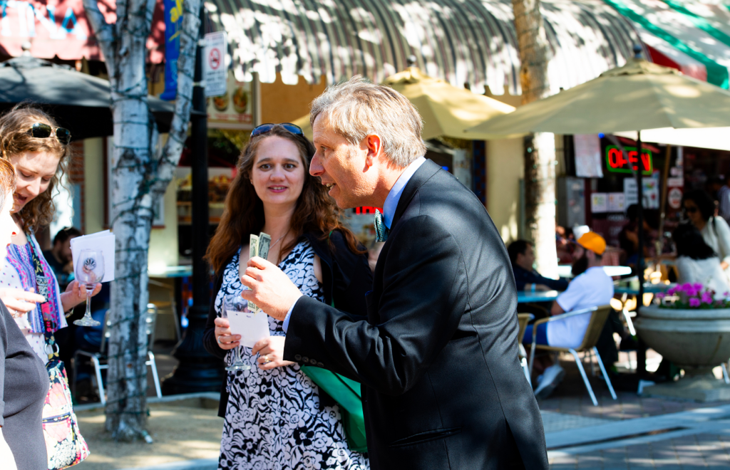 Tom Collett performing close-up magic for guests