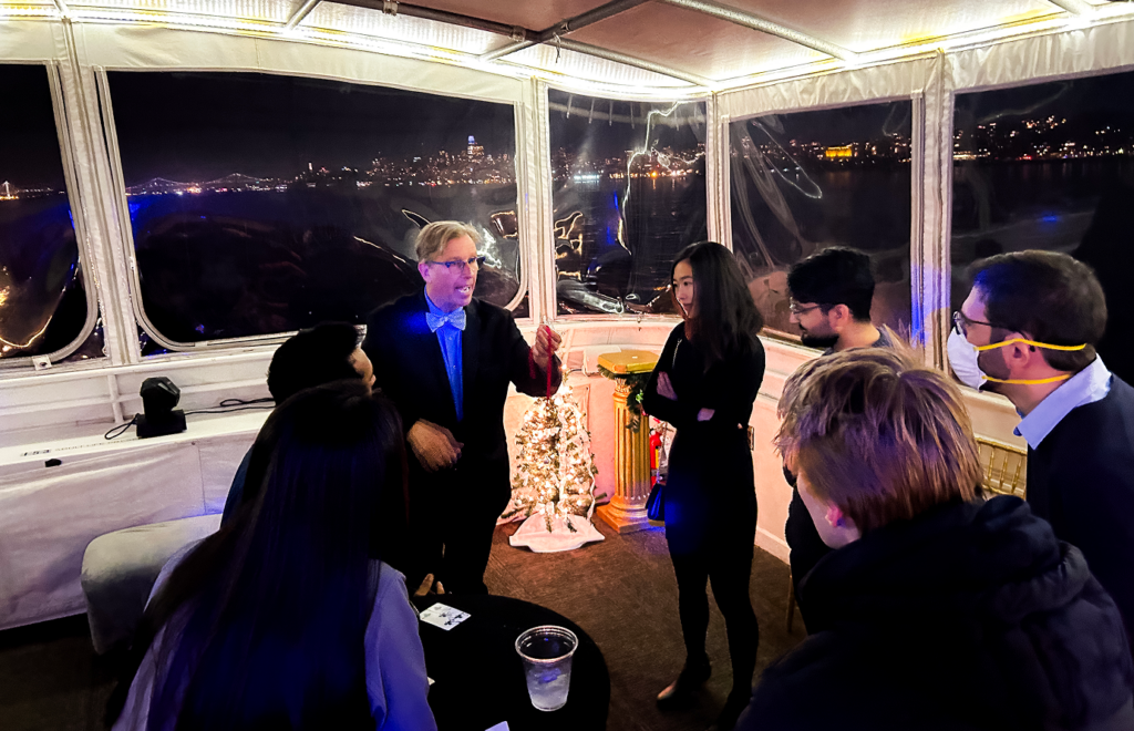 Guests watching close-up magic performance