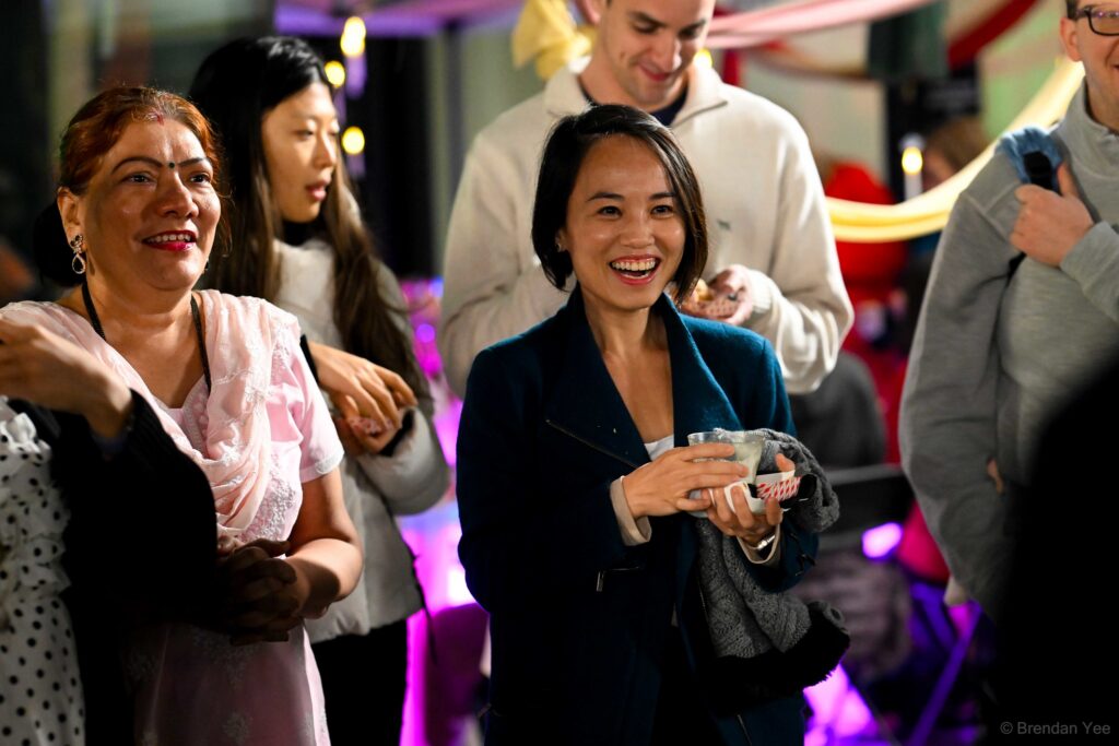 Guests enjoying close-up magic at a Bay Area event