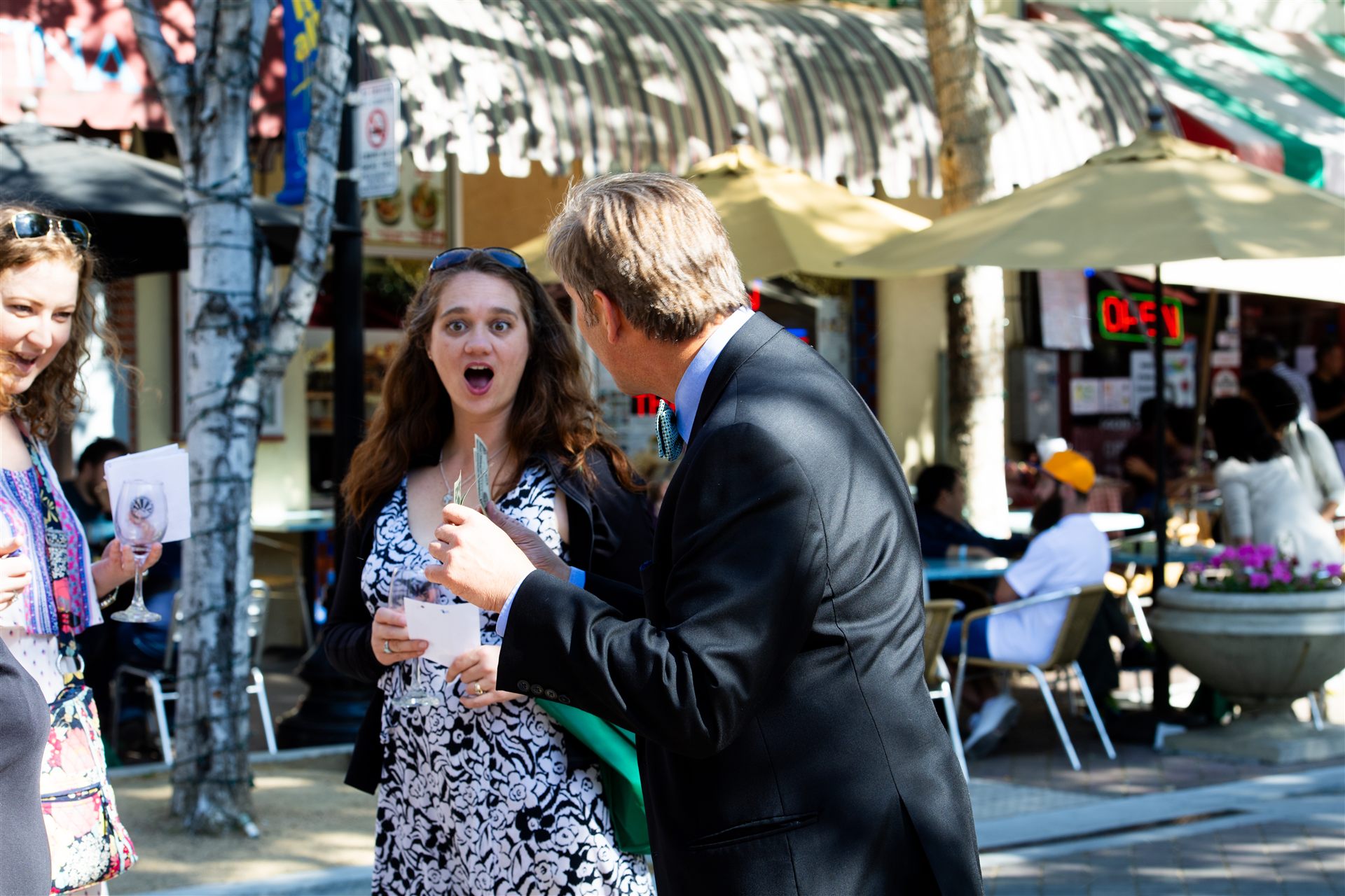 Audience member reacting with surprise during a magic performance